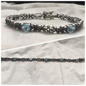 Sterling silver bracelet with aquamarine stones.
